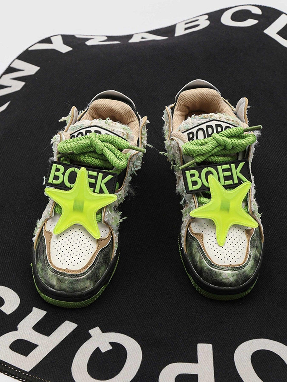 Unique TALISHKO sneakers featuring green star accents and textured details on a bold backdrop.