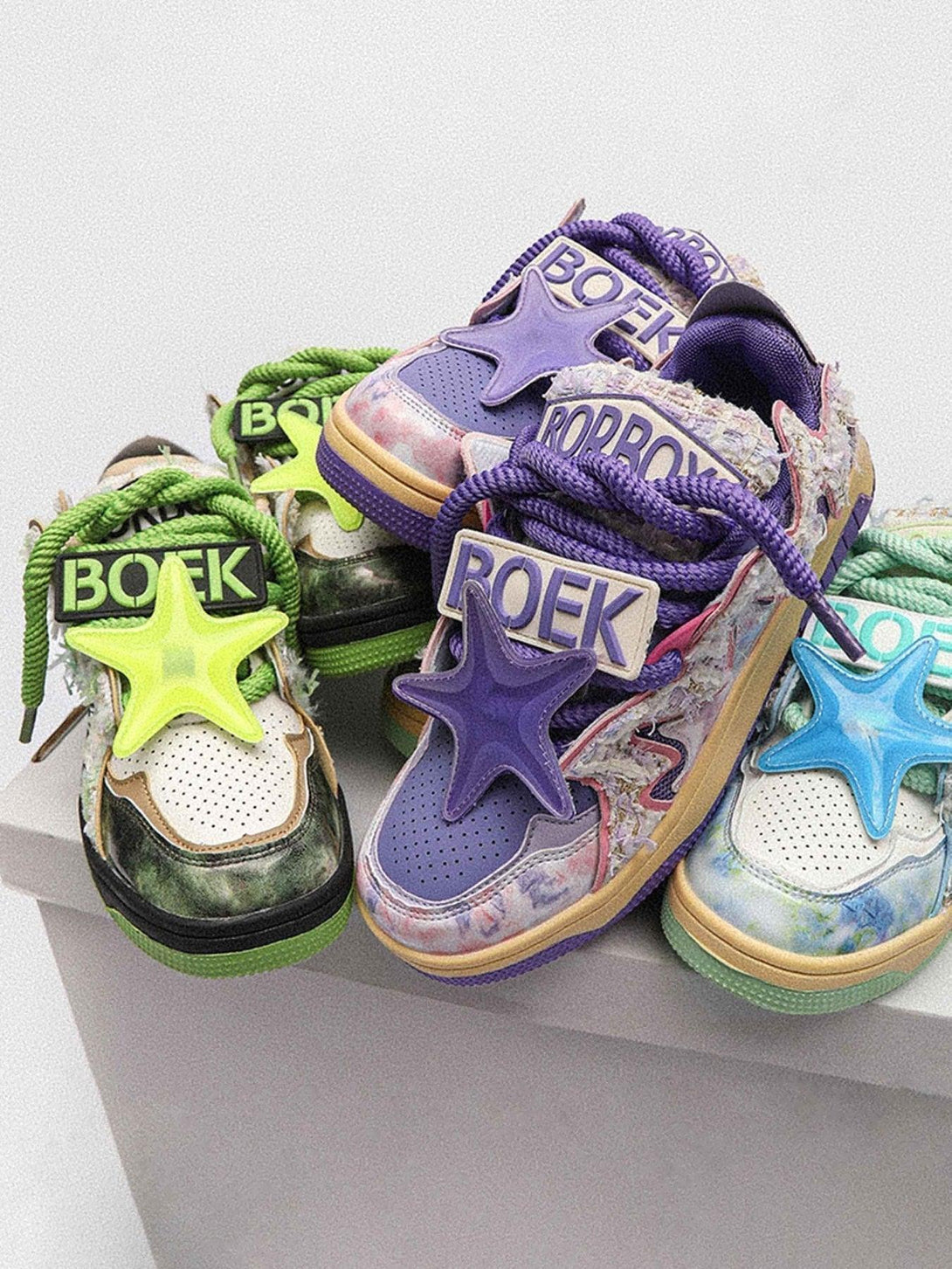 Colorful TALISHKO sneakers with star accents and mixed textures, perfect for high street style.
