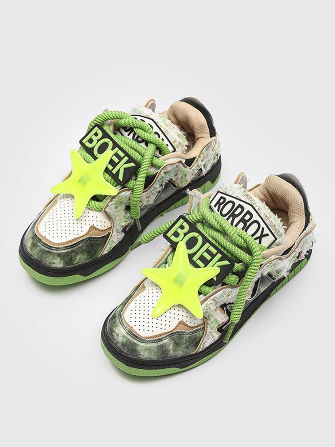 TALISHKO high street sneakers with green laces and star accents, offering a retro-inspired look.