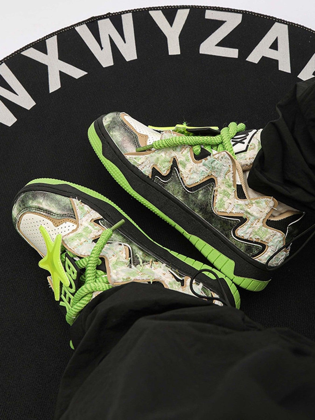 Bold TALISHKO sneakers with green accents and zigzag patterns, perfect for high street style.