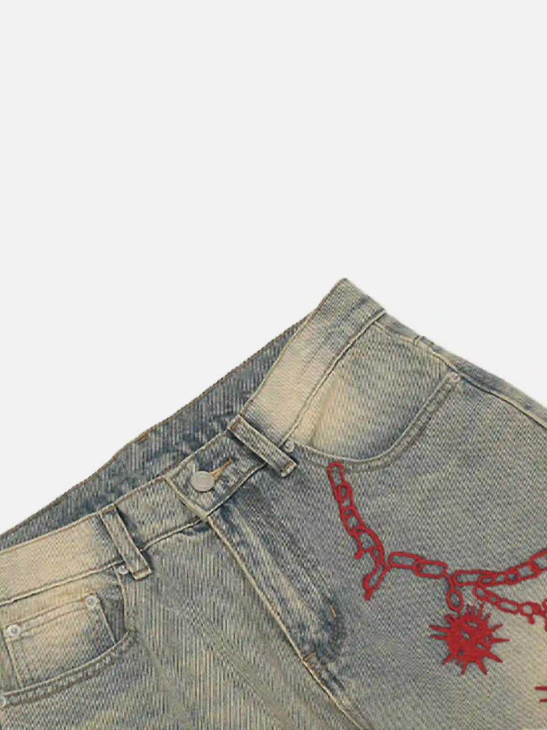 A close-up of TALISHKO jeans with red chain embroidery, emphasizing the retro hip-hop design.
