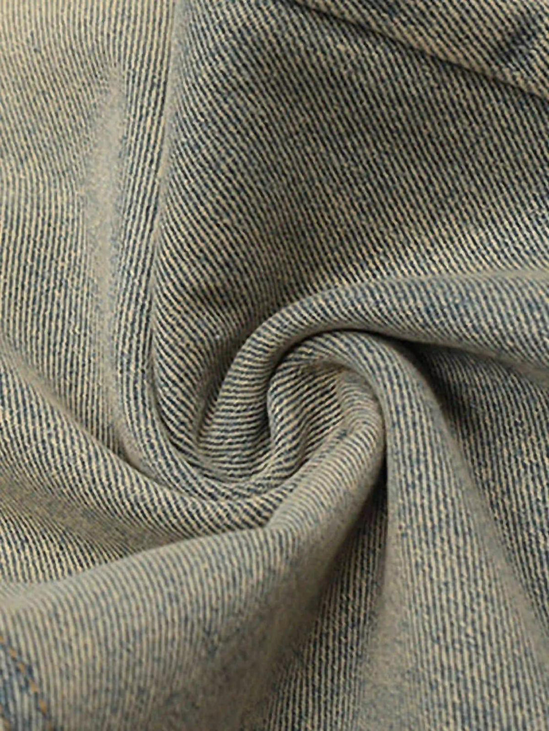 Zoomed-in texture of TALISHKO jeans fabric, highlighting the retro hip-hop style.