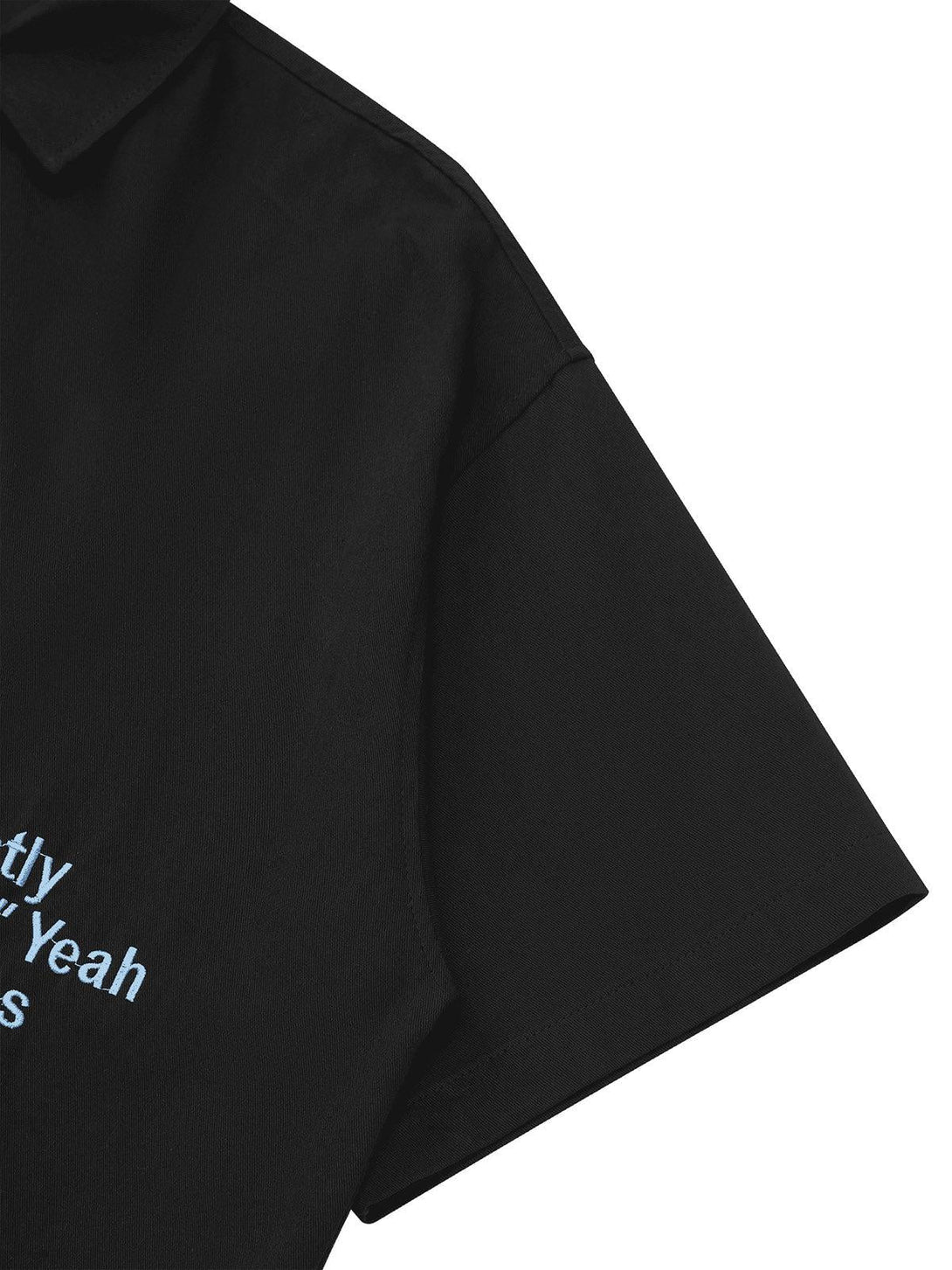 A side view of a black TALISHKO shirt highlighting embroidered letters on the sleeve.