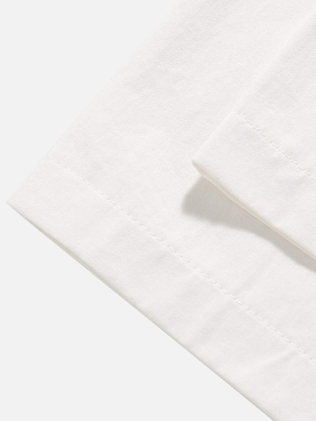 Detailed fabric and stitching of TALISHKO's short-sleeved shirt, showcasing quality craftsmanship.