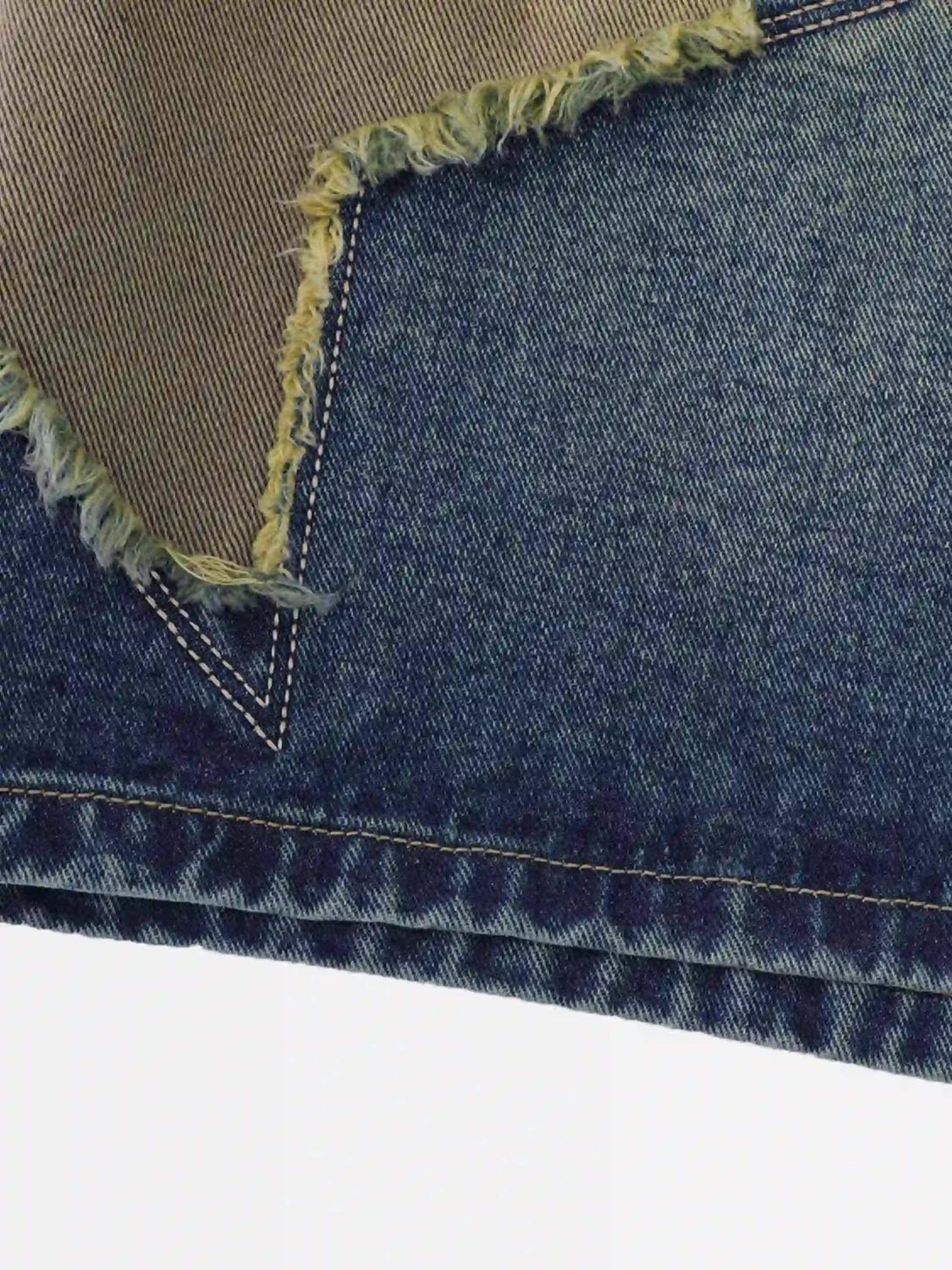 Intricate look at TALISHKO's patchwork denim texture, showcasing retro-inspired design.