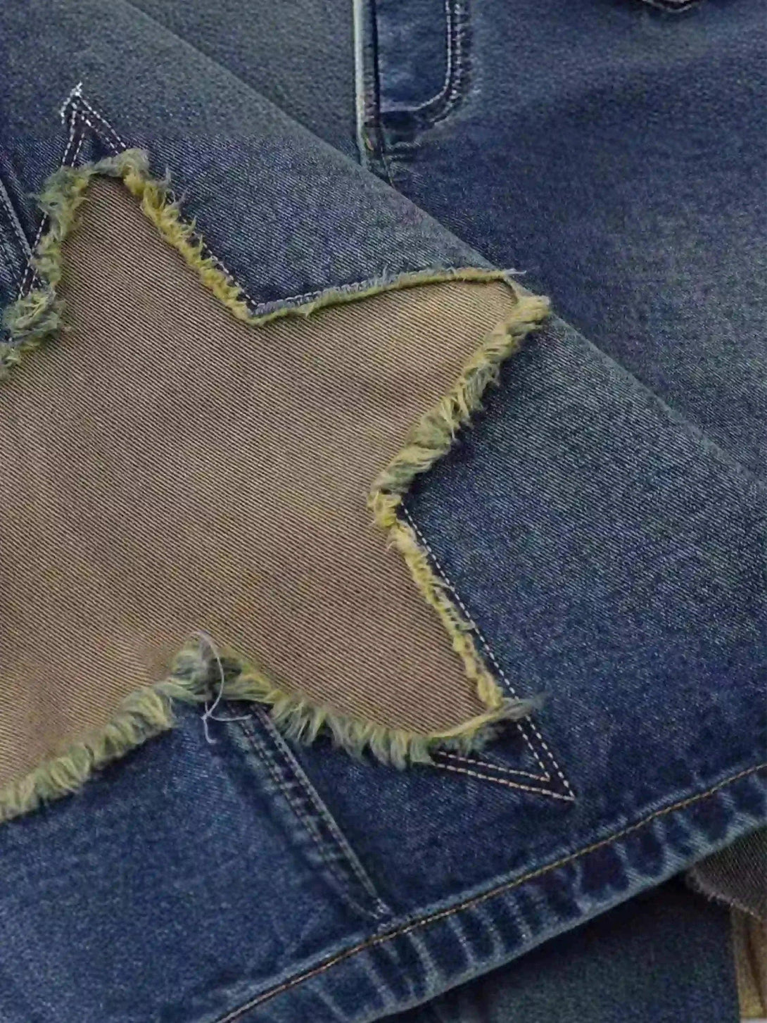 A detailed view of TALISHKO's star patchwork denim, highlighting its unique retro design.