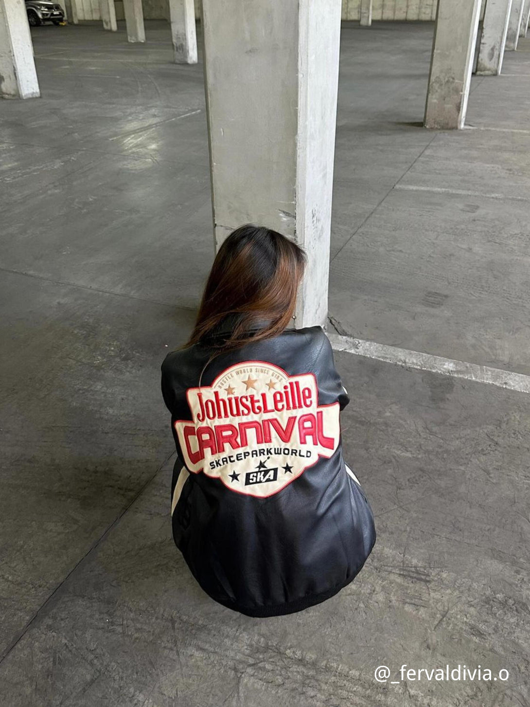Back view of TALISHKO's retro patchwork motorcycle jacket with bold lettering, adding urban flair.
