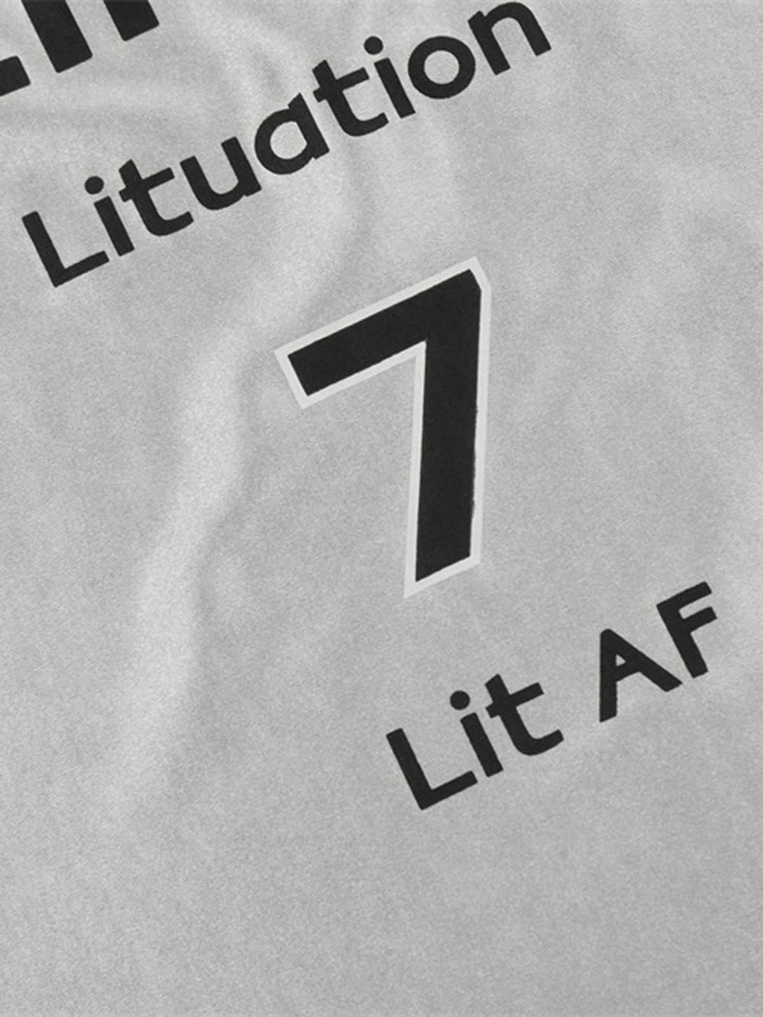 Zoomed-in view of TALISHKO's silver T-shirt showcasing bold black text and number design.