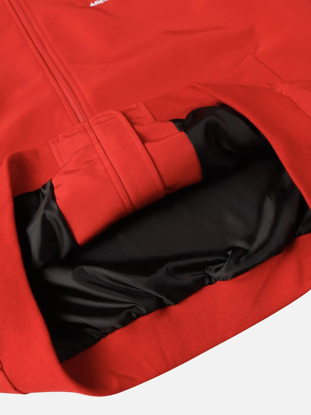 Detailed fabric and lining of the red TALISHKO sports jacket, showcasing quality craftsmanship.