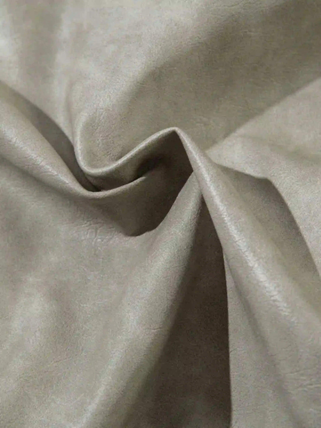 Texture and pattern showcased on TALISHKO motorcycle jacket's fabric, highlighting its softness.