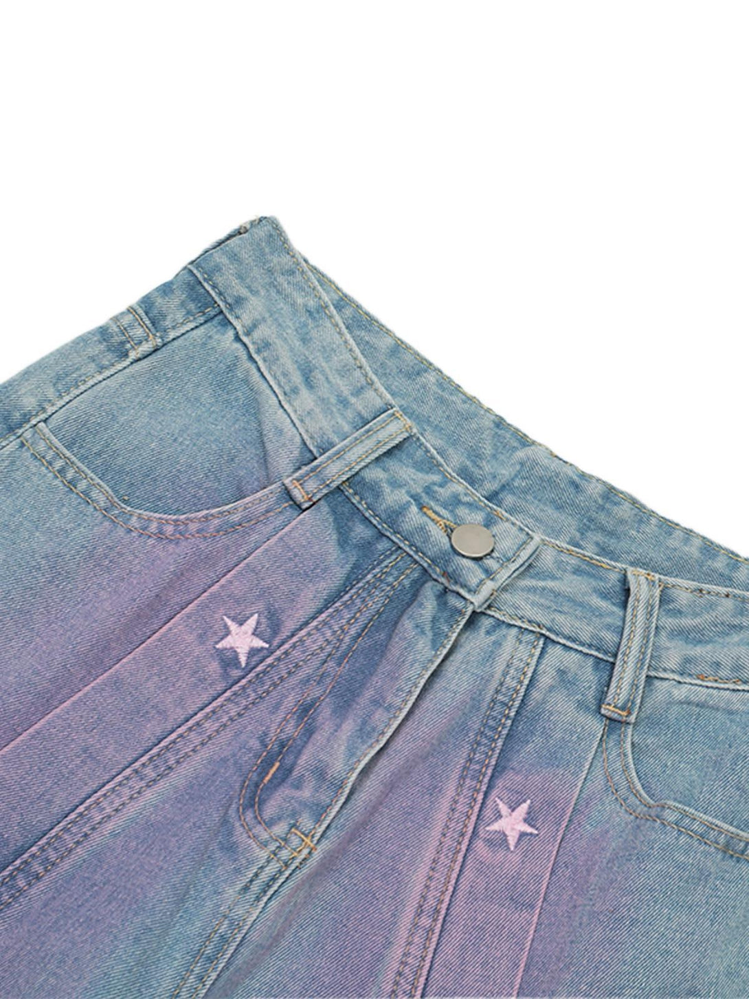 Detailed view of TALISHKO jeans with star embroidery and spray-painted design for a retro touch.