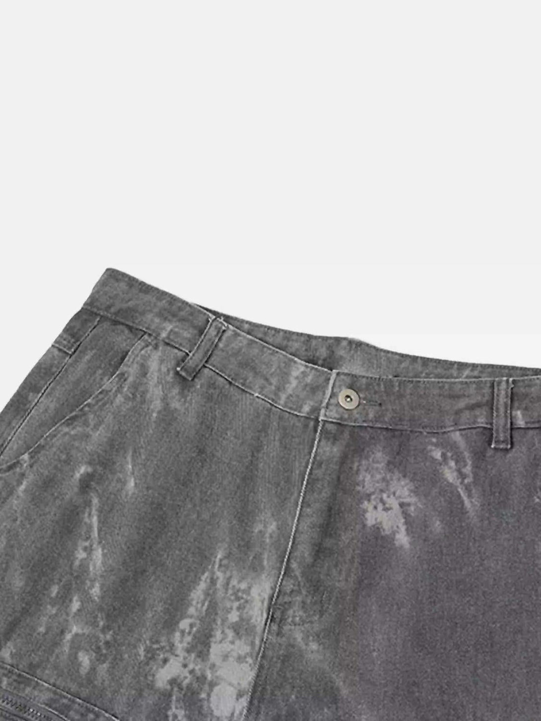 A close-up of TALISHKO overalls, showcasing the intricate texture and unique wash pattern.