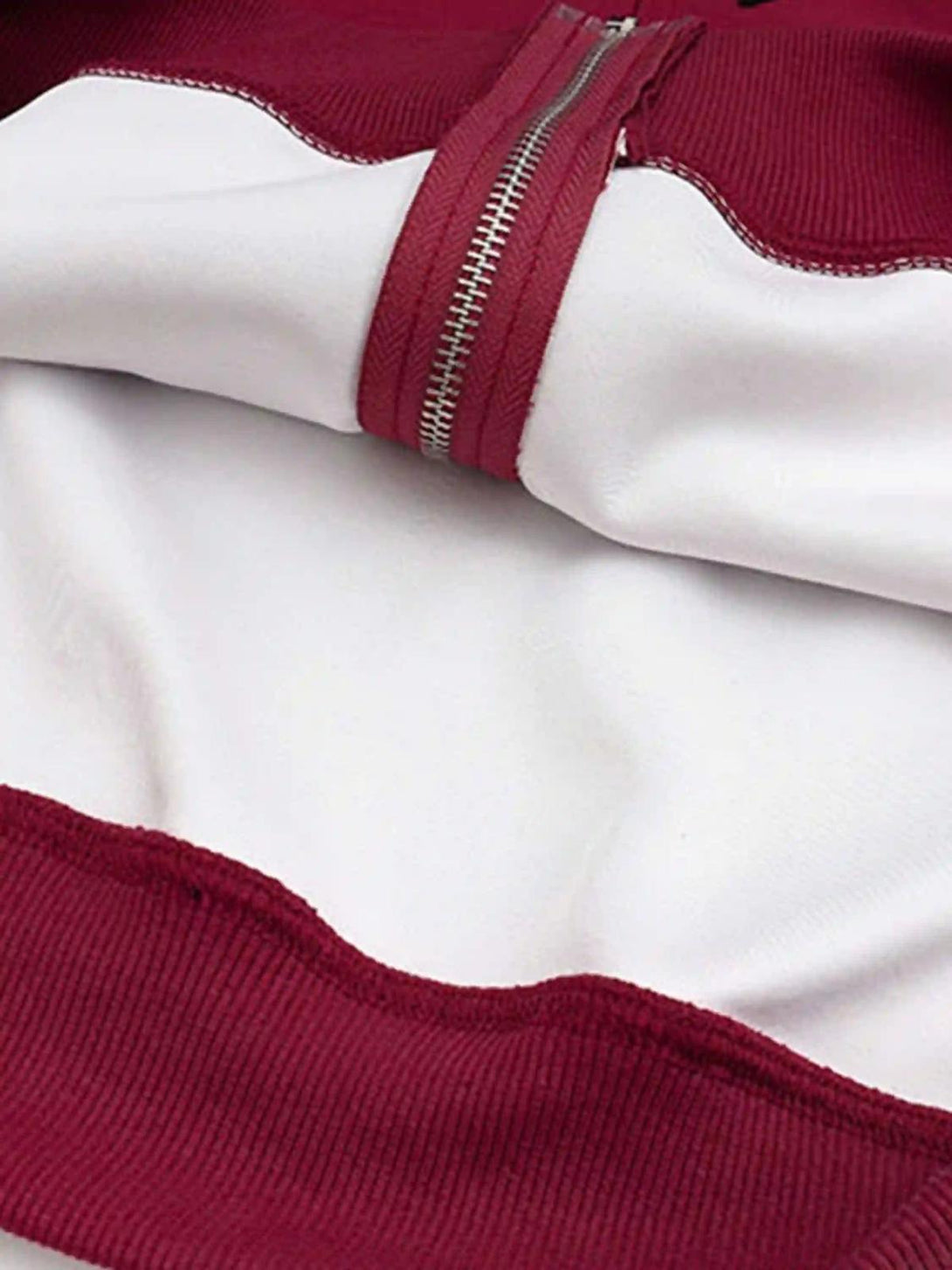 Detailed fabric and stitching of TALISHKO cardigan hoodie with white and red color contrast.