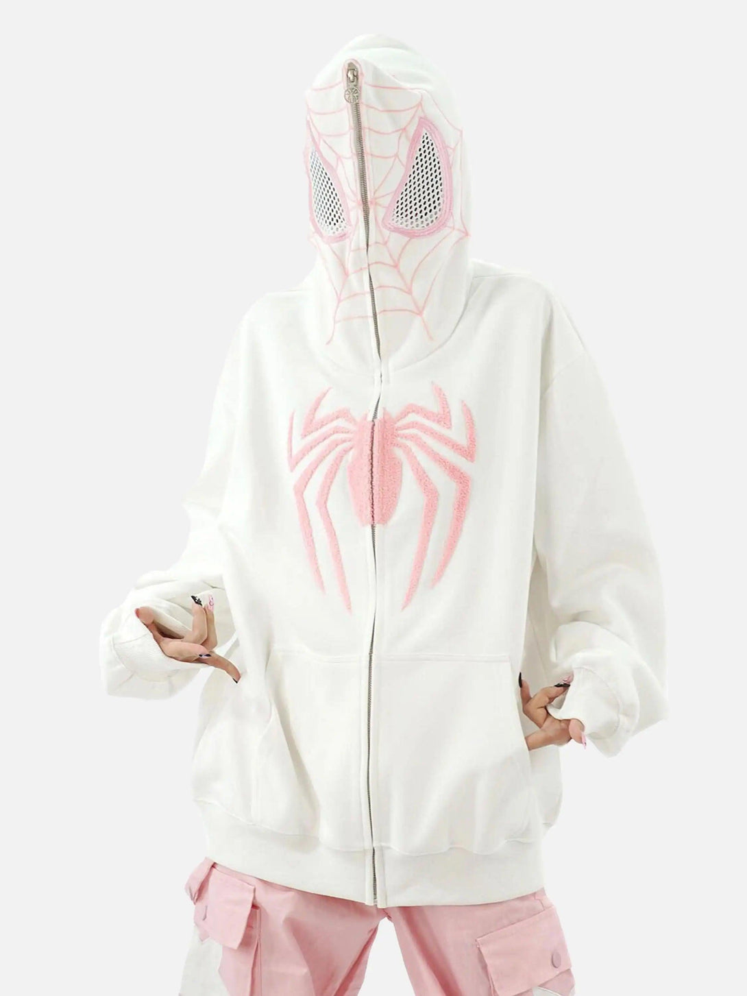Model wearing a white TALISHKO hoodie with pink spider embroidery and a zip-up web-patterned hood.