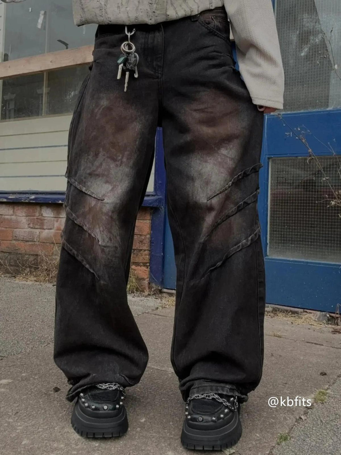 Street style with TALISHKO's heavy industry washed jeans, featuring rugged details and texture.