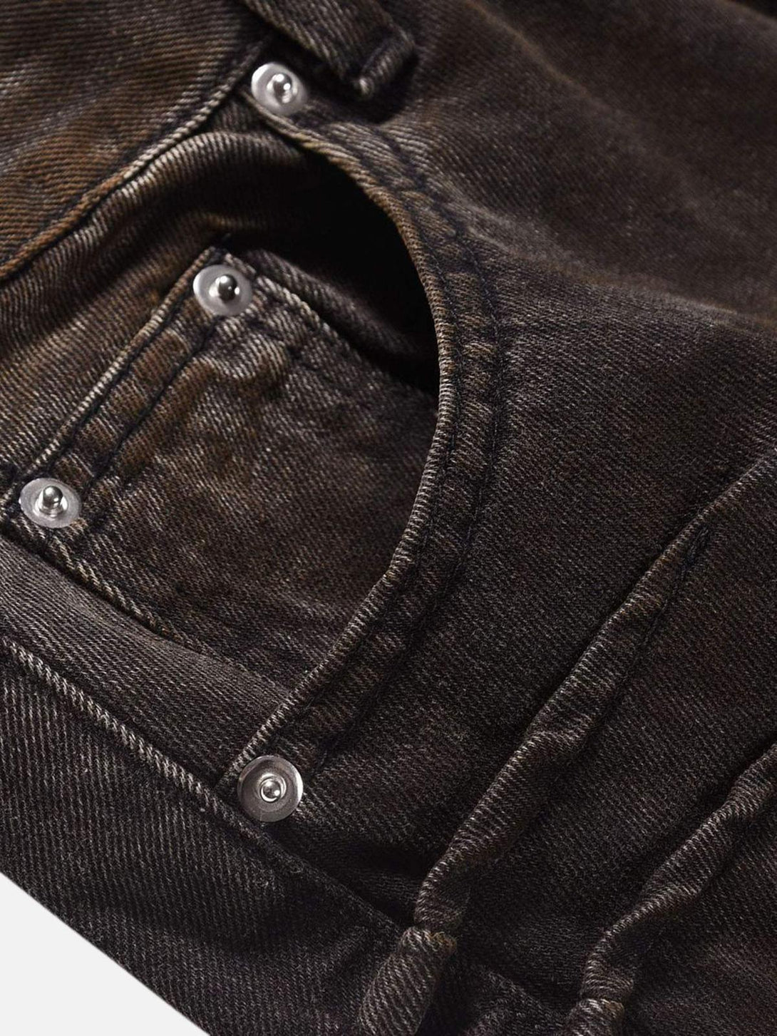 Detailed fabric and stitching of TALISHKO jeans, highlighting rugged industrial style.