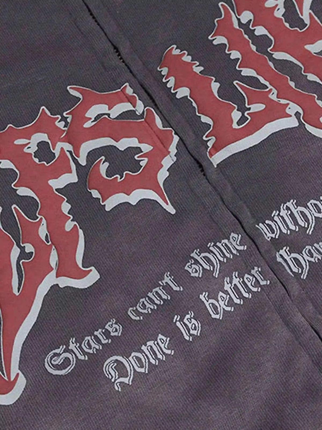 Intricate look at the TALISHKO hoodie design with bold lettering on soft fabric.