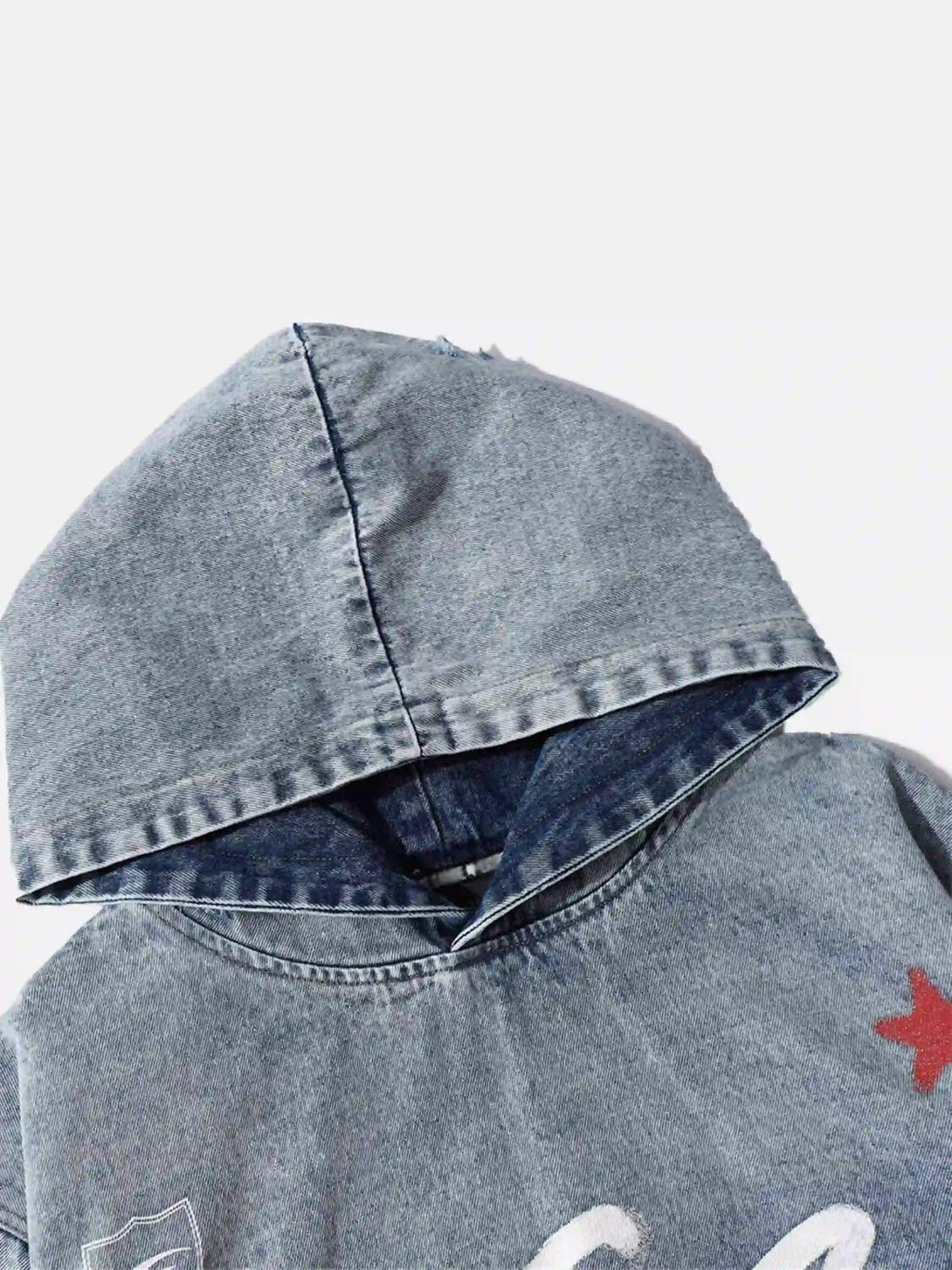 Detailed view of TALISHKO's gradient denim hoodie, focusing on the hood and stitching.
