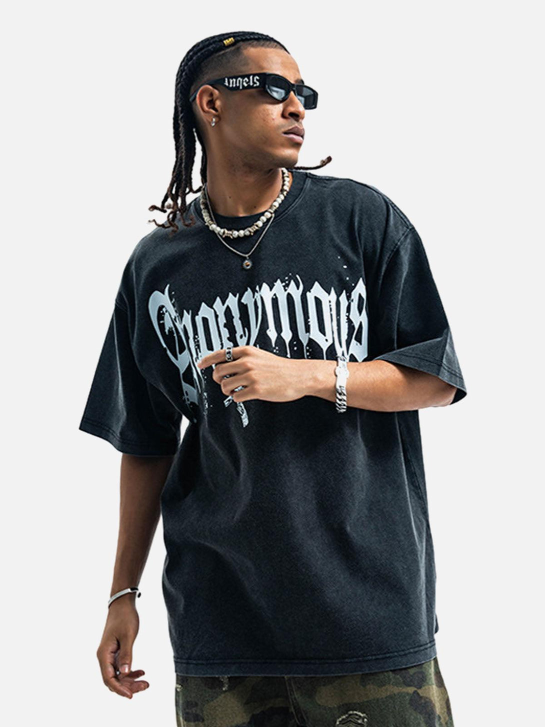 Model wearing a TALISHKO Gothic T-shirt with bold lettering and distressed style.