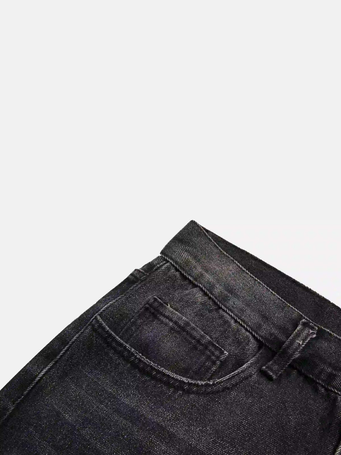 Detailed texture and stitching of TALISHKO jeans, highlighting quality craftsmanship.