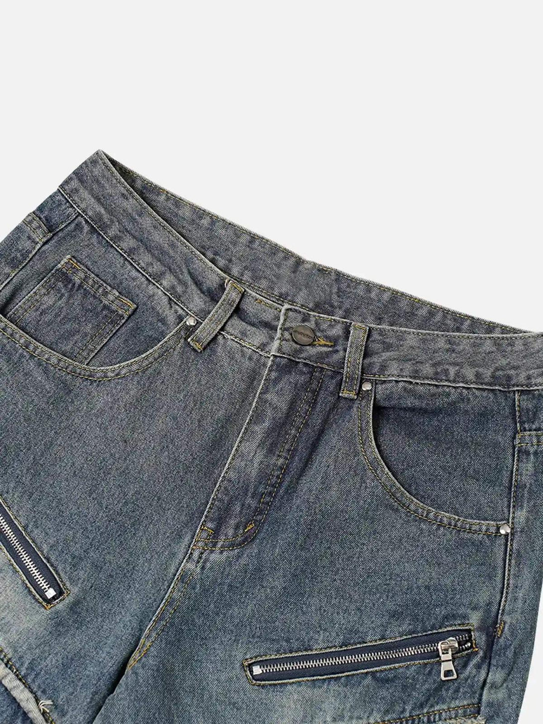 A tight crop highlighting TALISHKO's distressed jeans with zipper details for a trendy look.