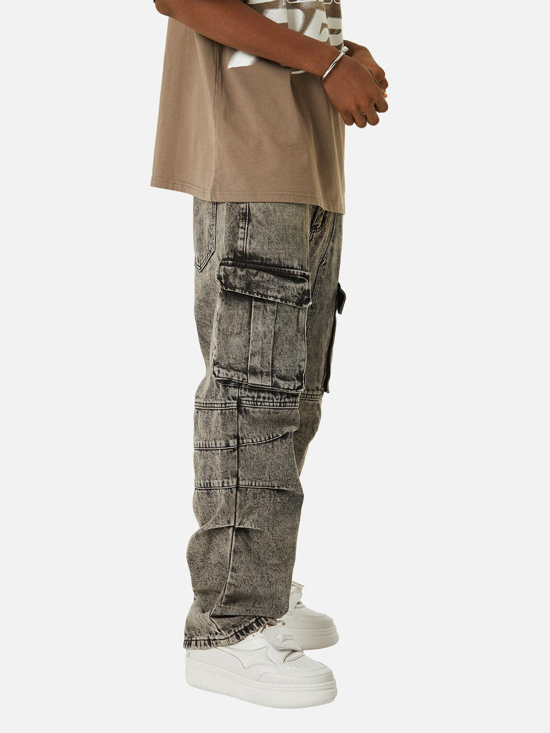 Side view of TALISHKO distressed work jeans paired with a casual tee and sneakers.