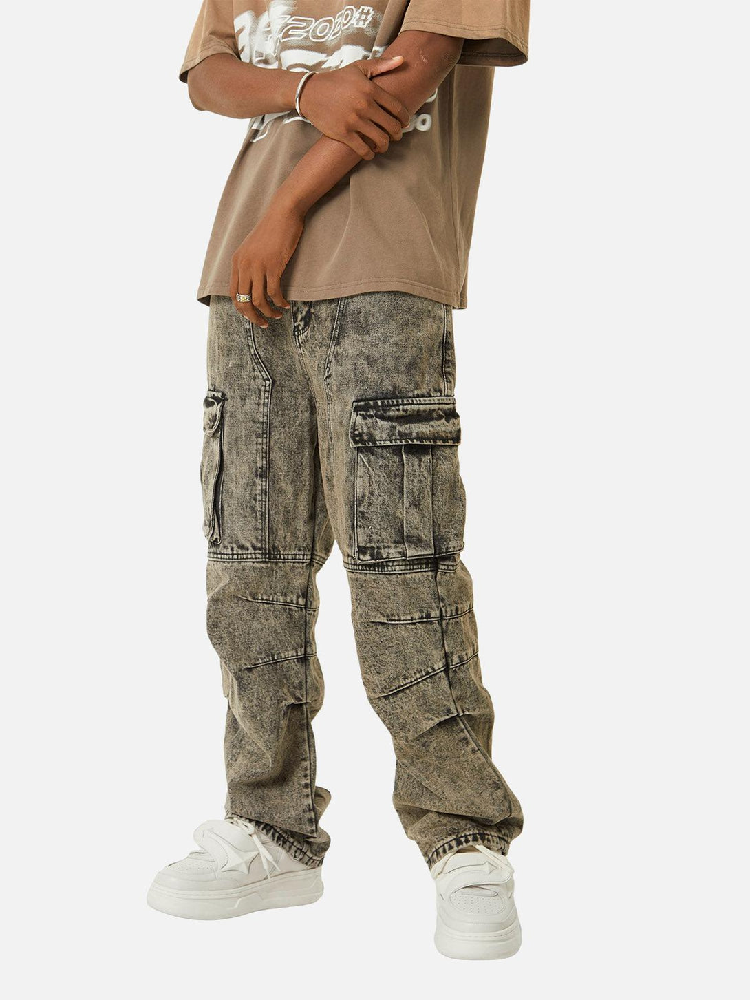 Model wearing TALISHKO washed distressed work jeans styled with a casual tee and sneakers.