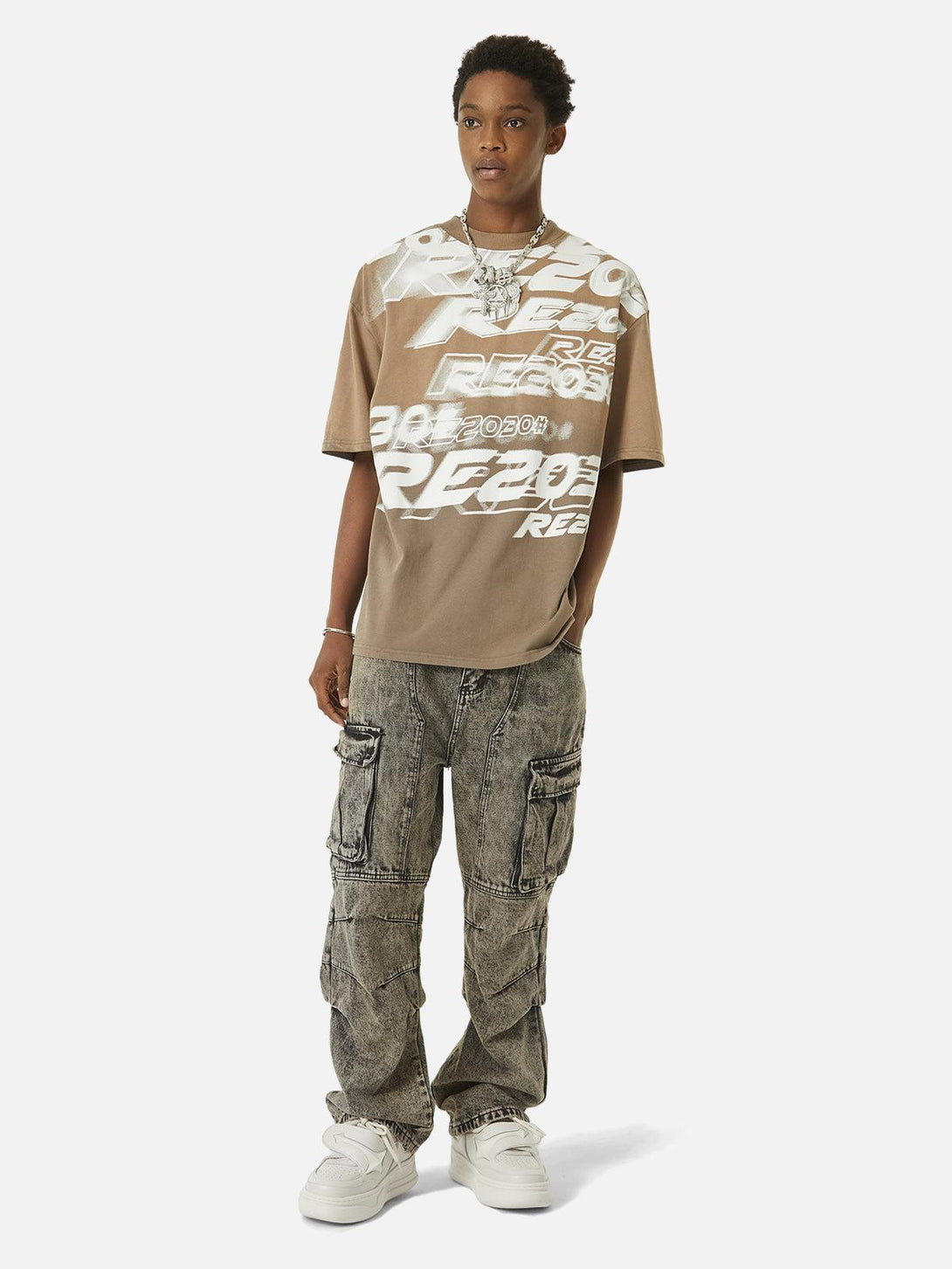 TALISHKO distressed jeans paired with a graphic tee, showcasing urban street style.
