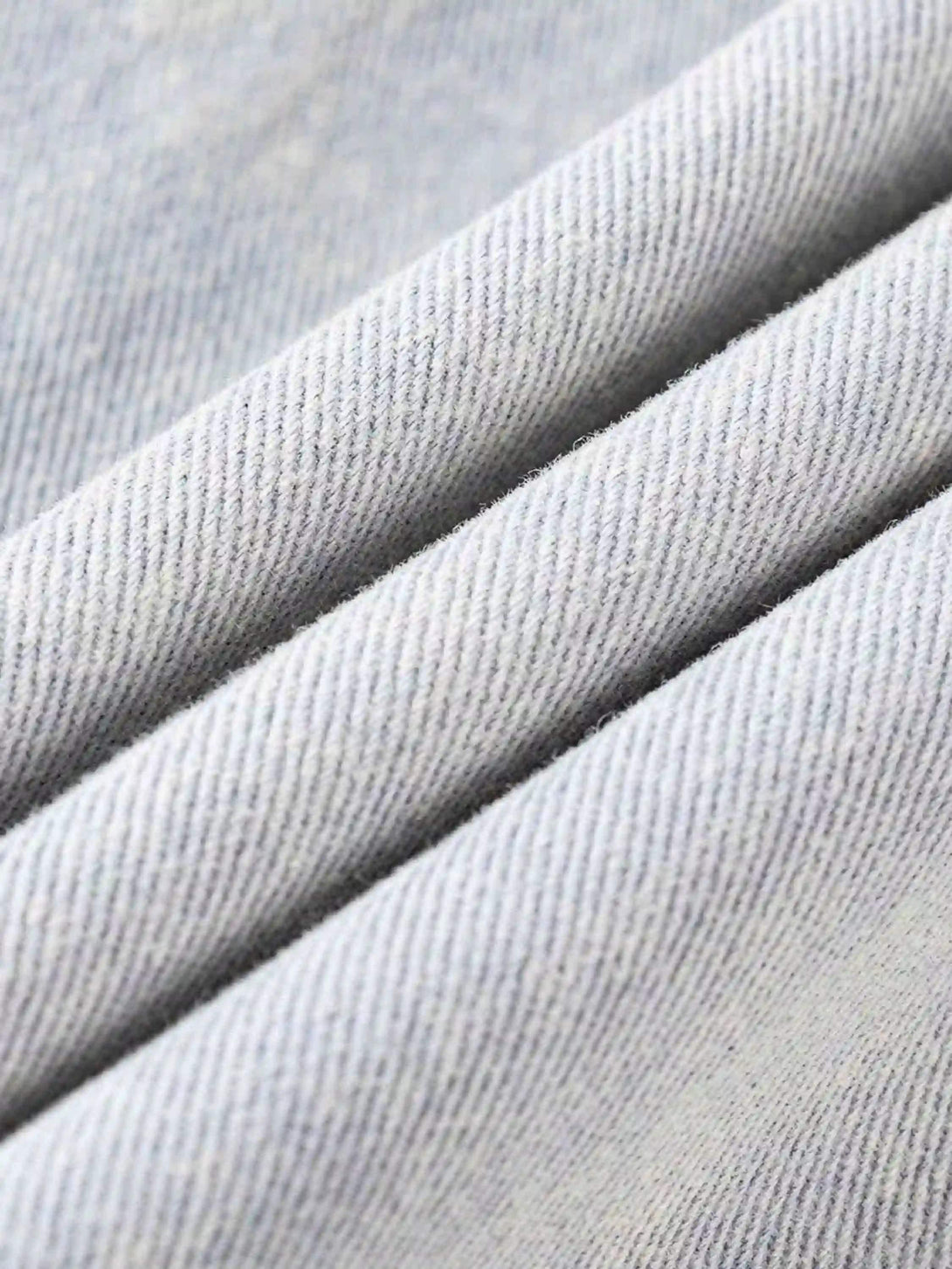 Texture and pattern showcased in TALISHKO's washed faded short jacket fabric detail.