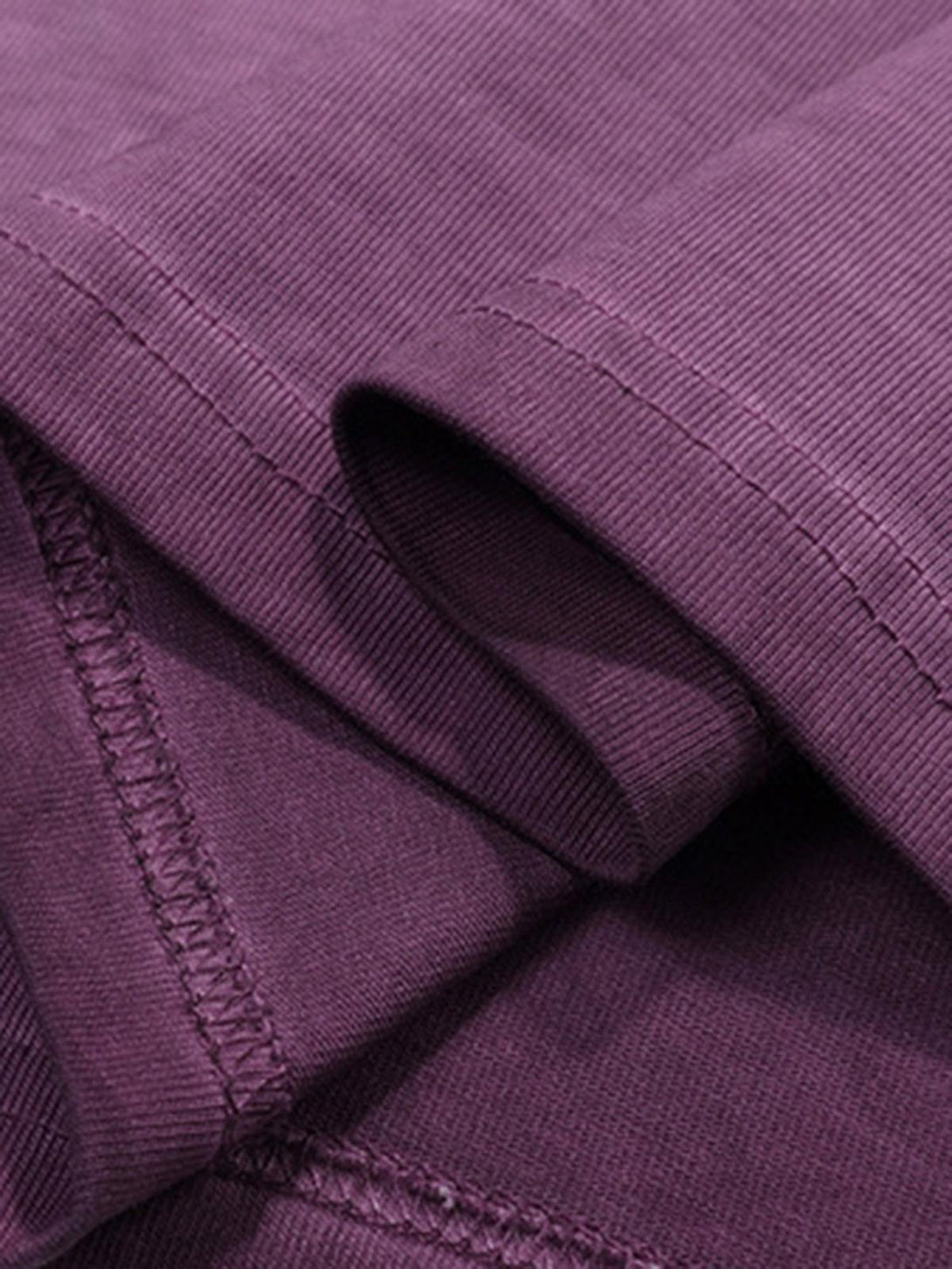 Detailed fabric and stitching of a purple T-shirt by TALISHKO, highlighting quality craftsmanship.