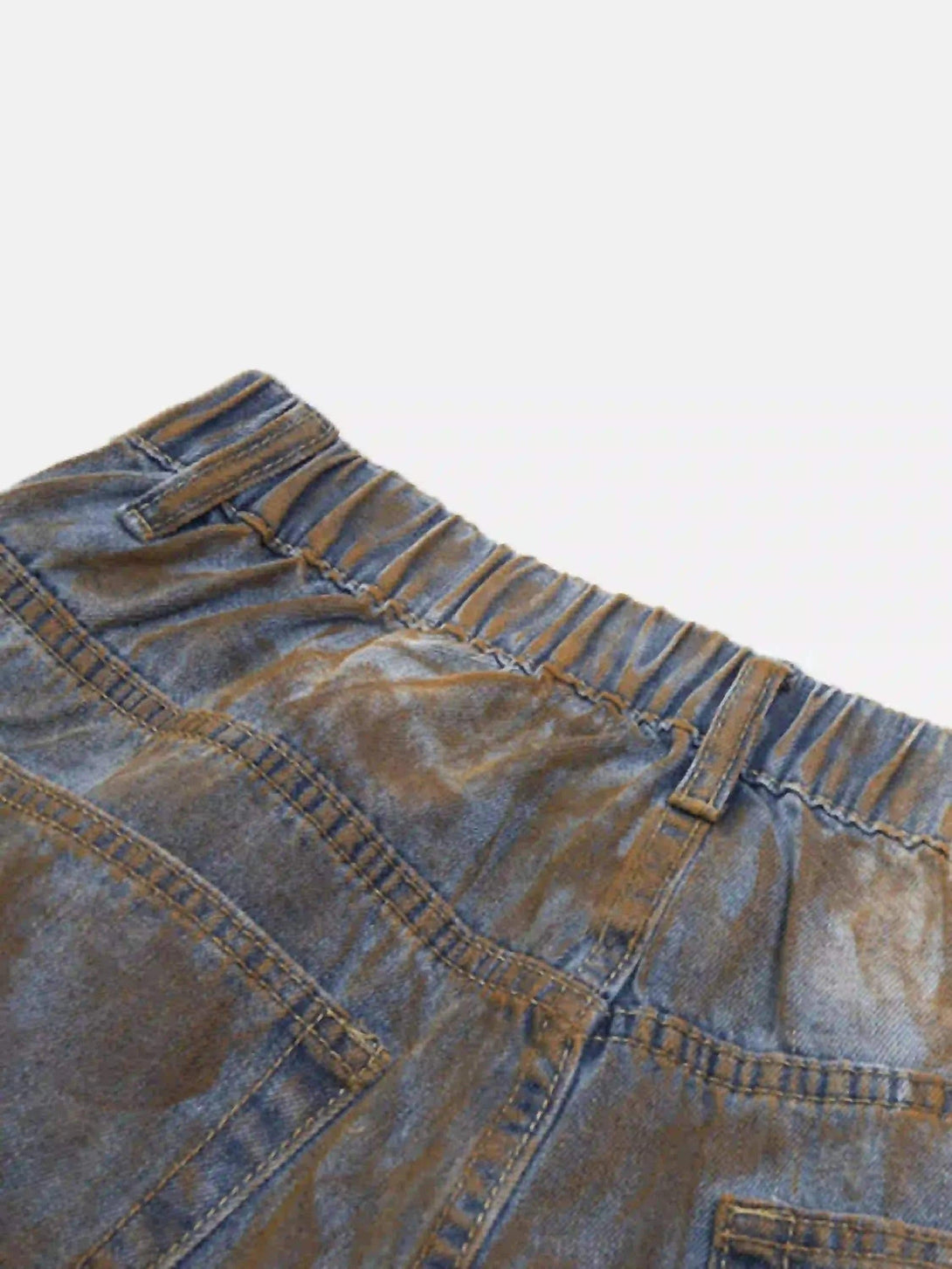 Elastic waistband detail of TALISHKO's wide-leg denim jorts, emphasizing rugged texture.