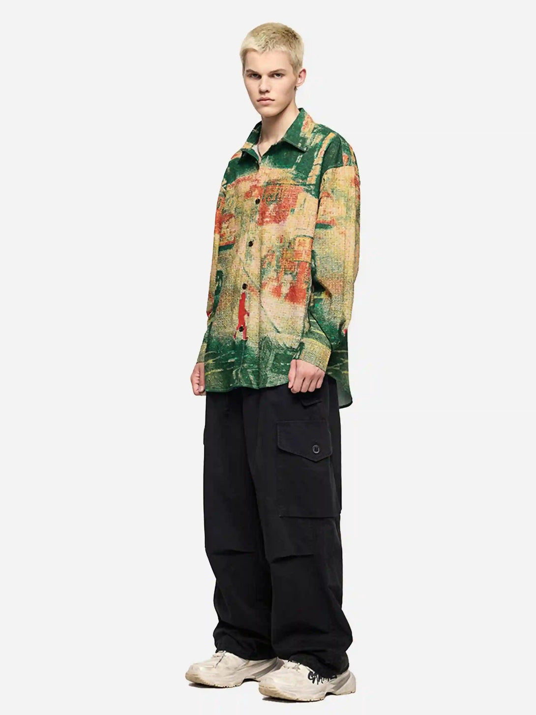 Model styled in TALISHKO's vibrant seersucker shirt paired with black cargo pants for a bold look.