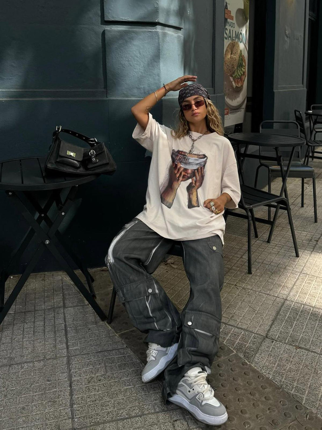 Casual street style with TALISHKO's loose print T-shirt and relaxed pants, perfect for summer.