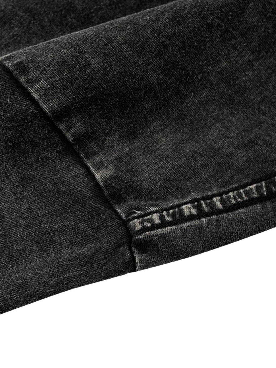Detailed fabric and stitching of a vintage hip-hop T-shirt by TALISHKO.