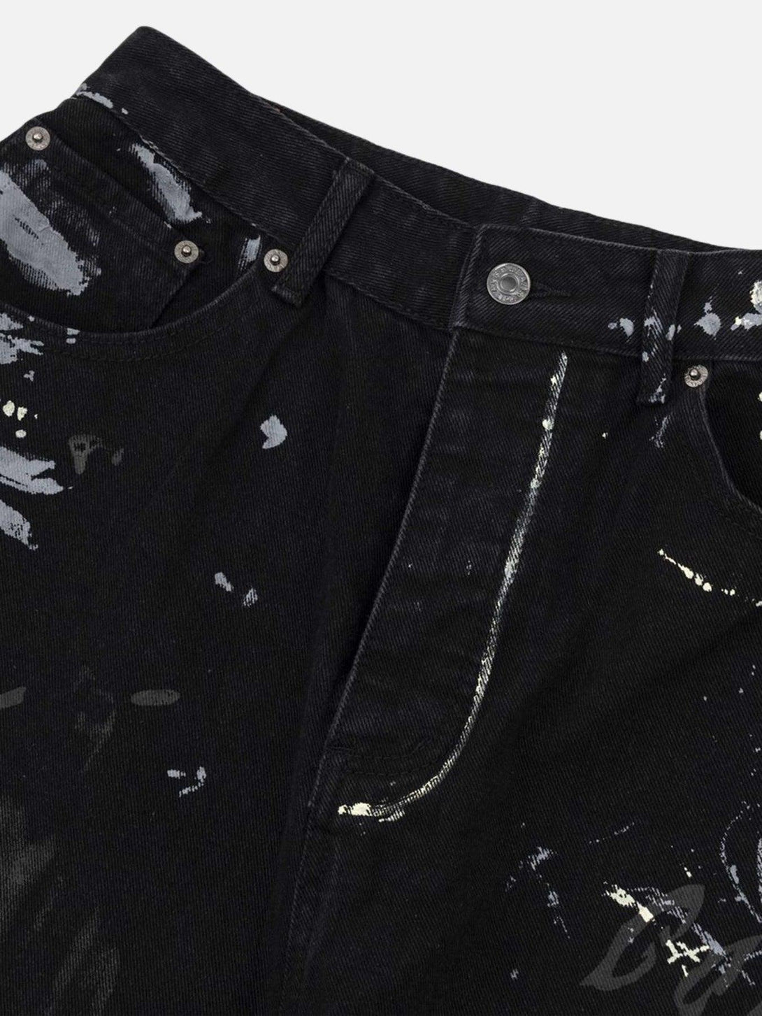 Focusing on the artistic splatter detail of TALISHKO's graffiti print jeans for a bold style statement.