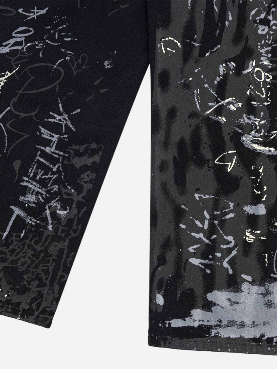 Intricate look at TALISHKO's graffiti print jeans, highlighting the artistic lettering detail.