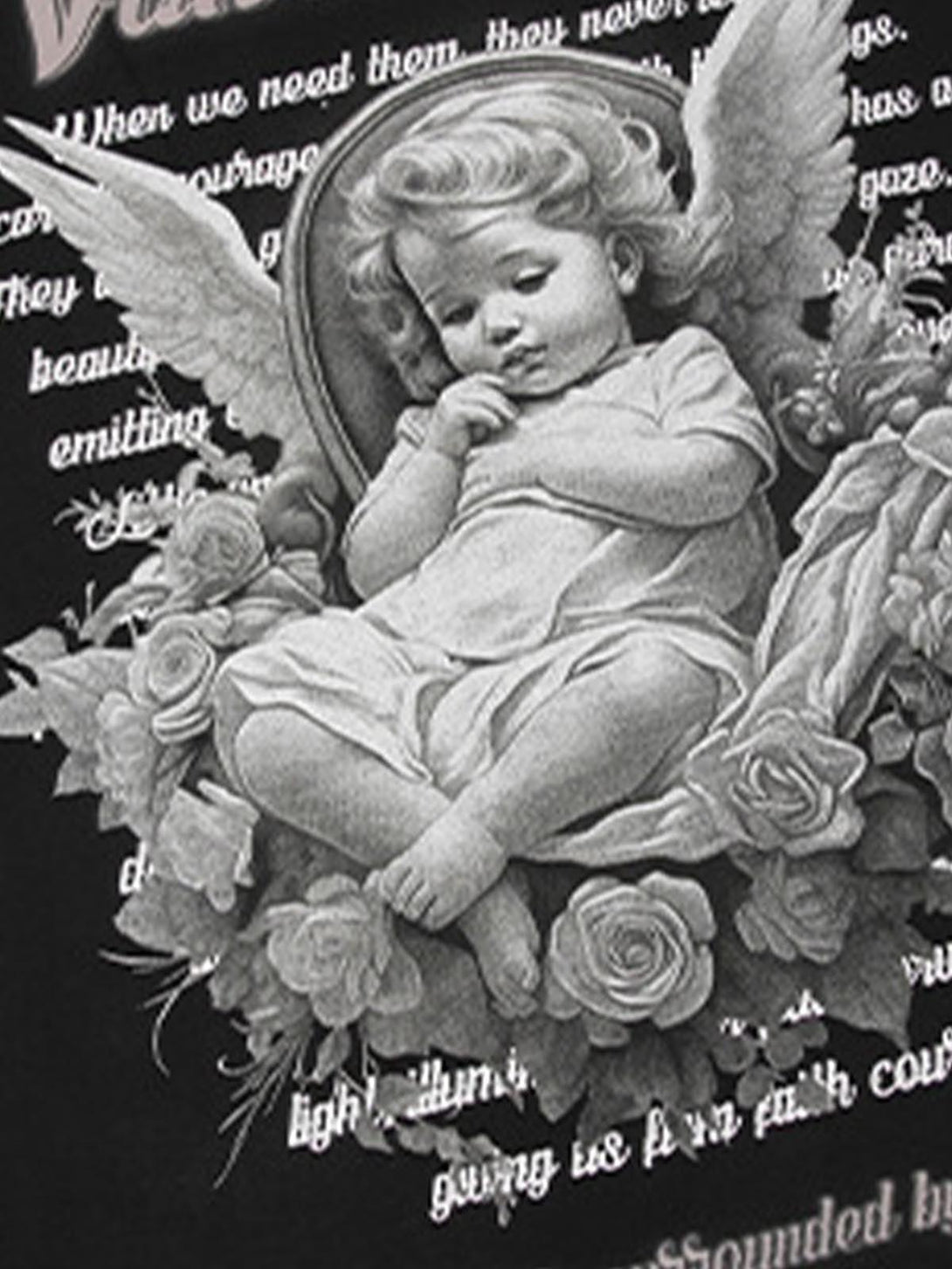 A detailed look at TALISHKO's oversized T-shirt, showcasing an angel print with floral elements.