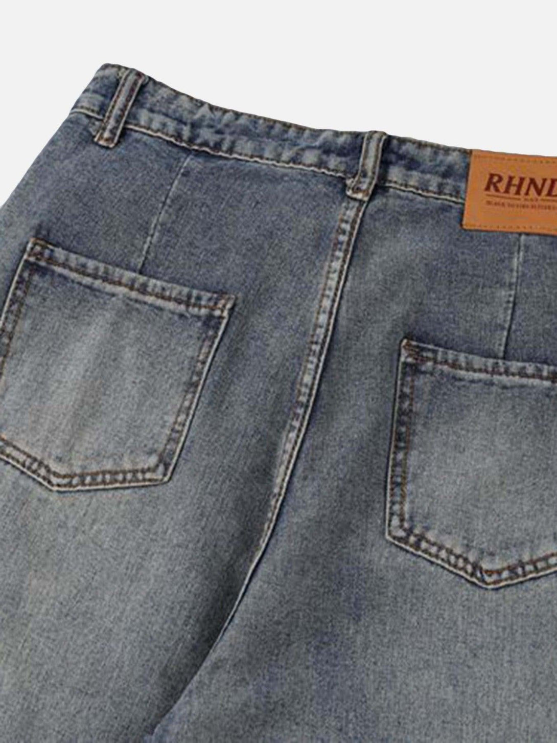 Detailed view of TALISHKO jeans' back pockets, highlighting subtle stitching and relaxed fit.