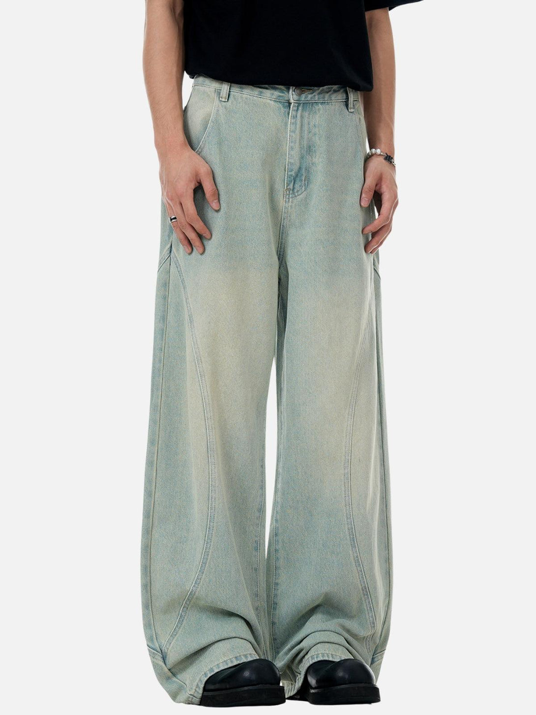 Wide-leg jeans by TALISHKO featuring unique arc patchwork and a relaxed fit for casual style.