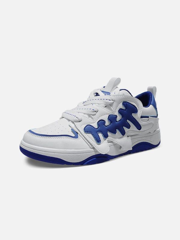 TALISHKO skate shoes in white with blue accents, showcasing a unique arrow pattern design.