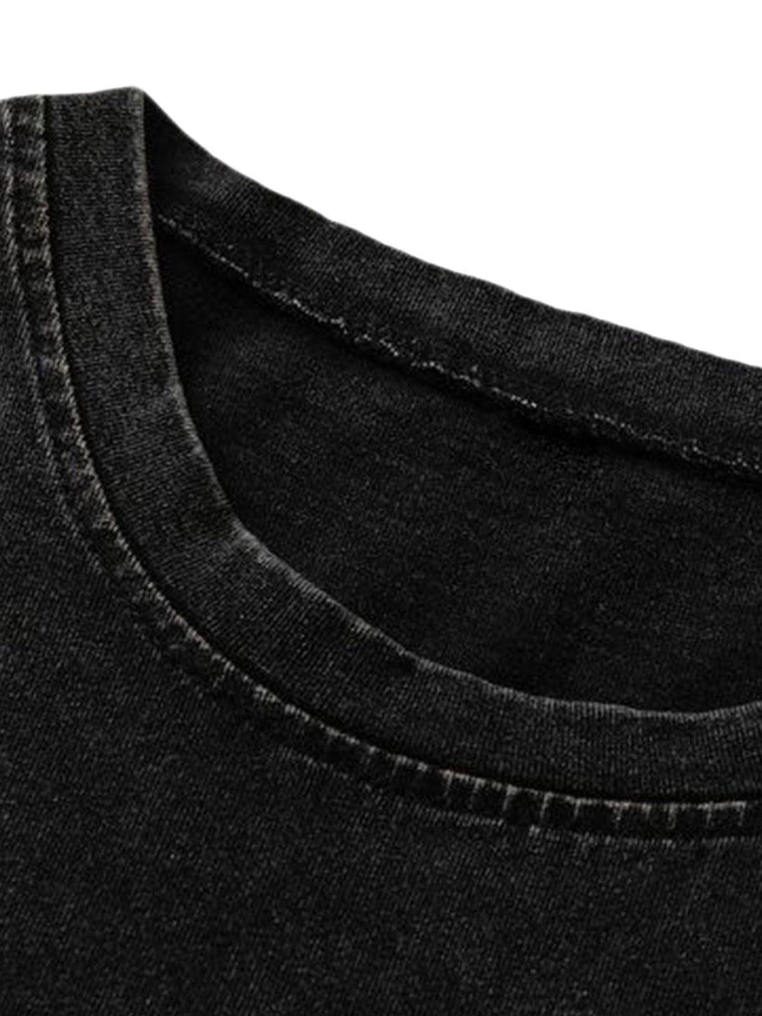 Detailed fabric and stitching on a black vest by TALISHKO, highlighting its washed texture.