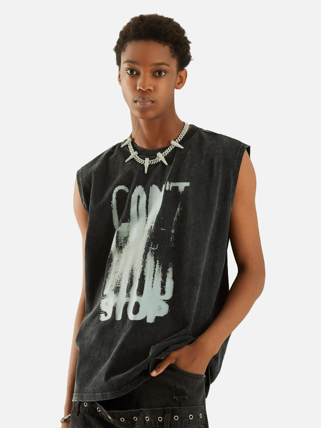 Model sporting a TALISHKO washed vest with art lettering, adding a trendy, relaxed vibe.