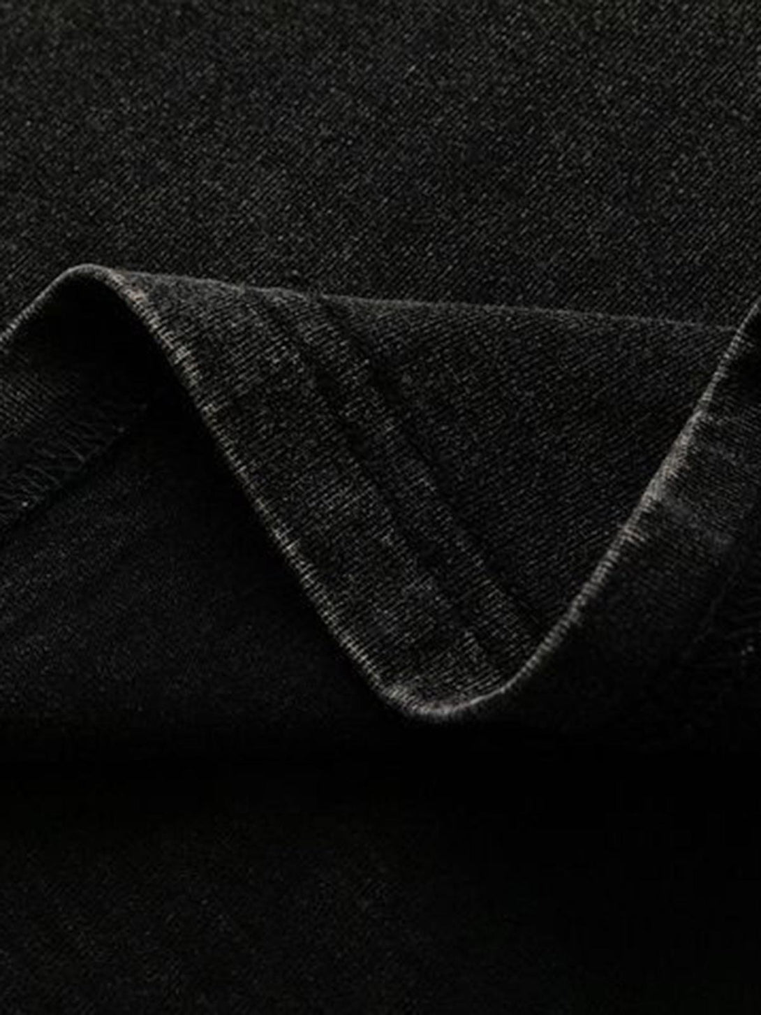 Focusing on the texture and detailed stitching of a distressed vest by TALISHKO.