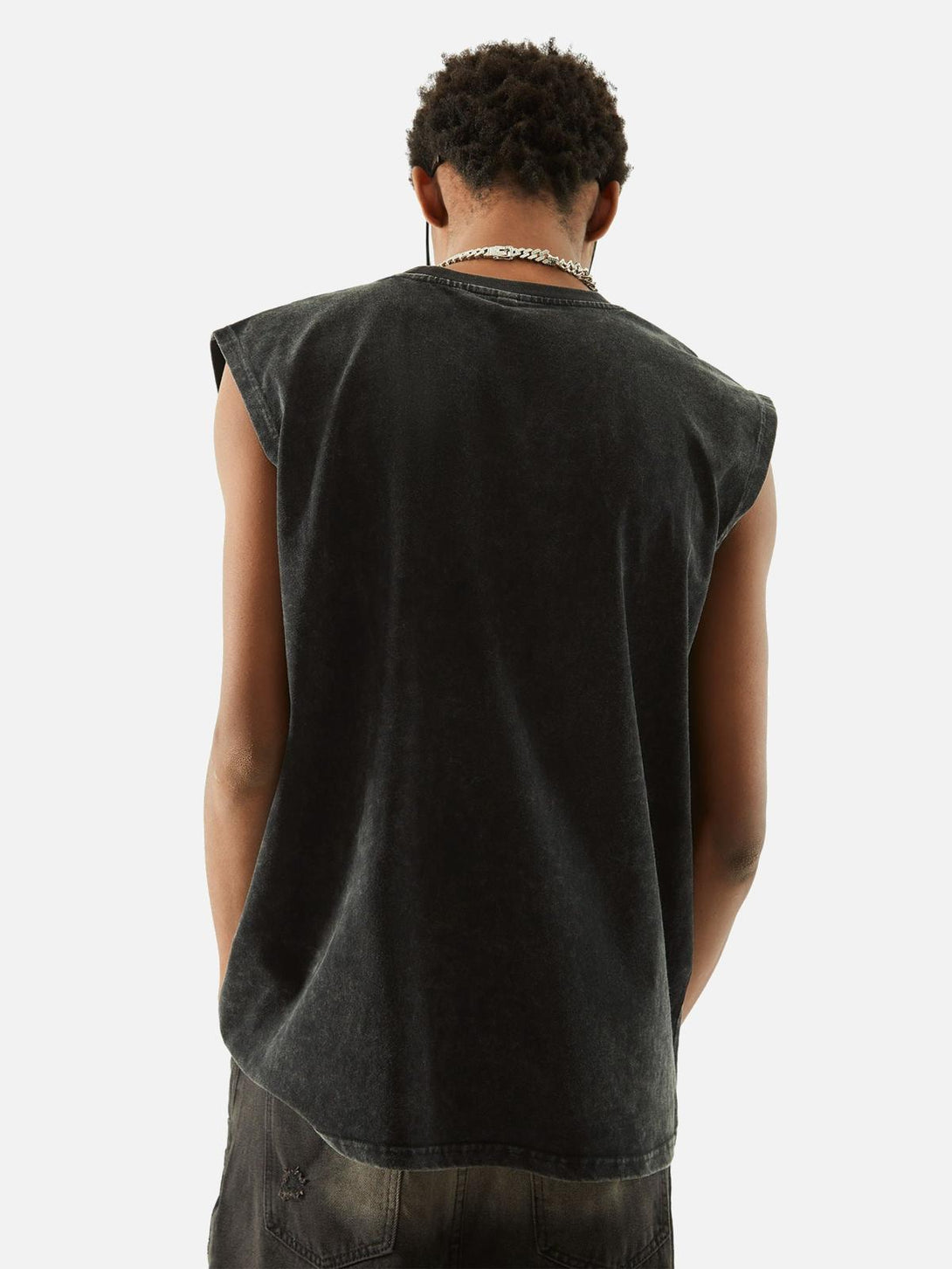 Back view of a washed distressed vest by TALISHKO, showcasing a relaxed, casual style.