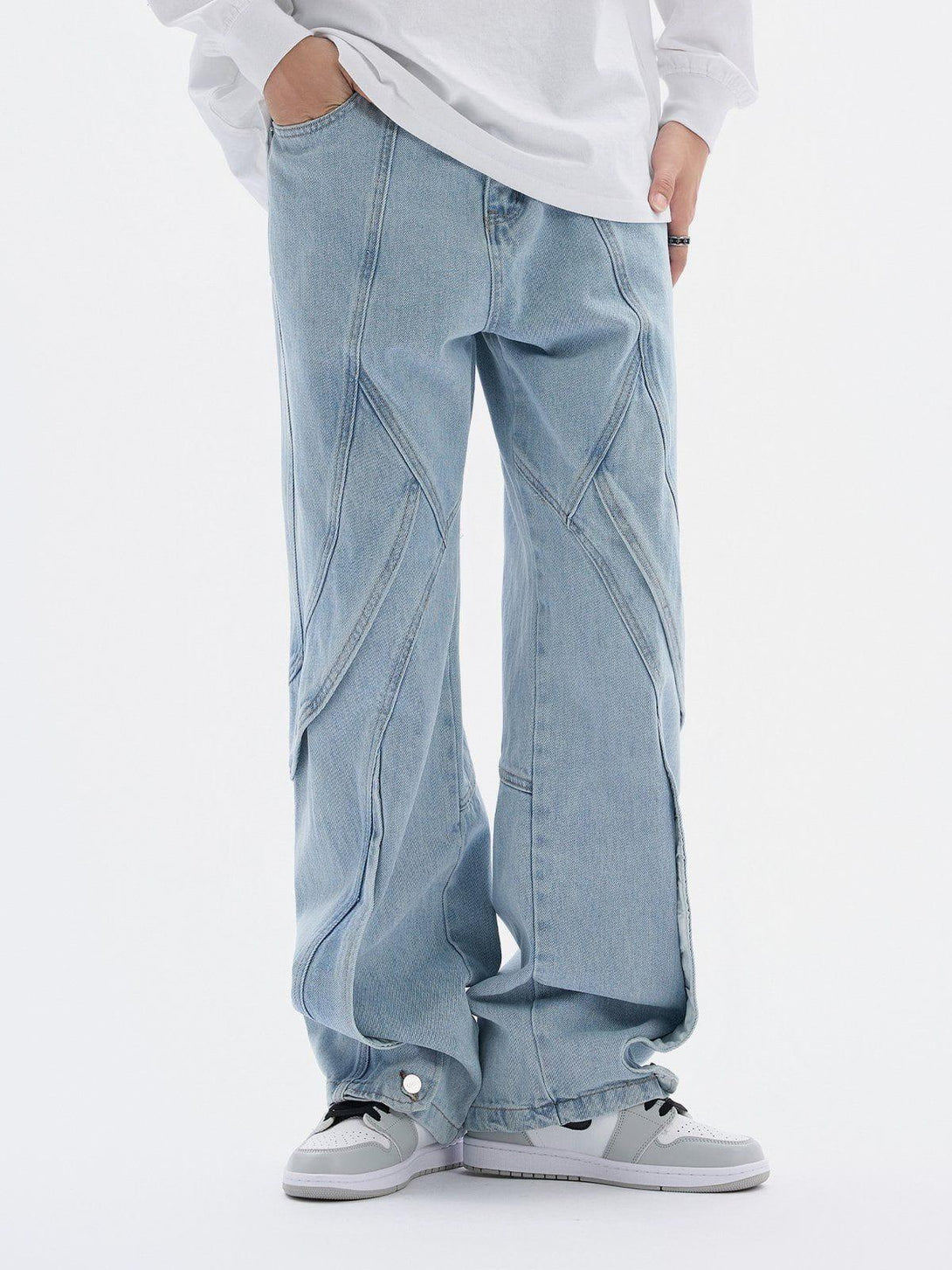 Model wearing TALISHKO artistic cut jeans, featuring unique seam design and relaxed fit.
