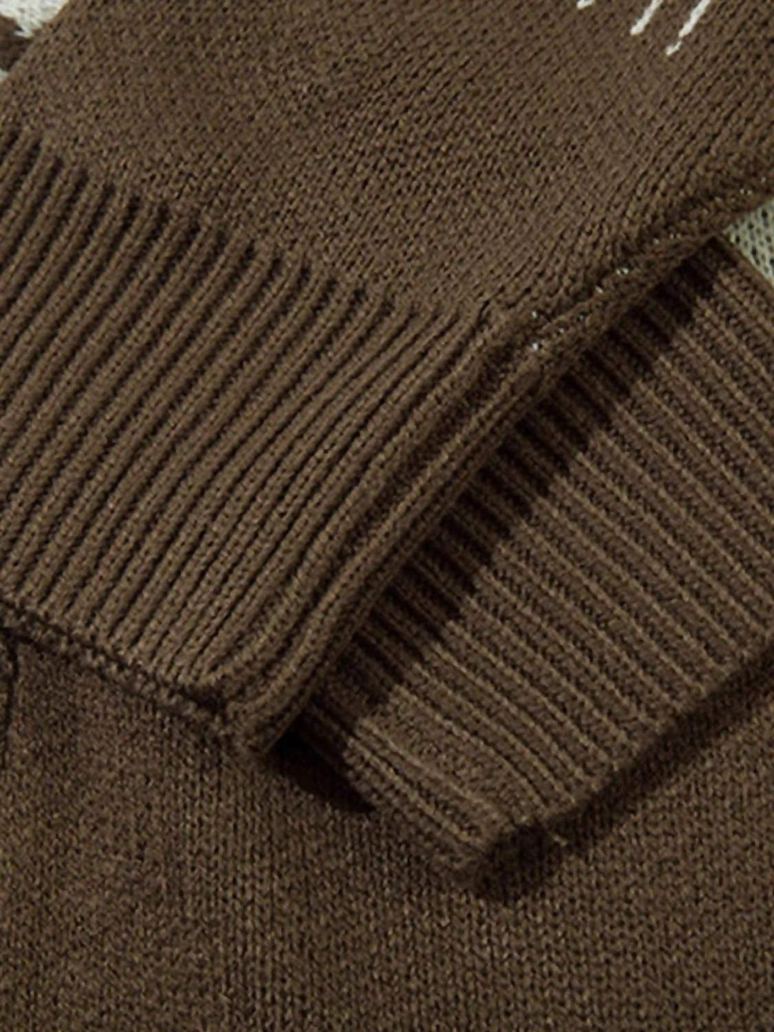 A close-up of the ribbed cuffs and knitted texture on a TALISHKO sweater.