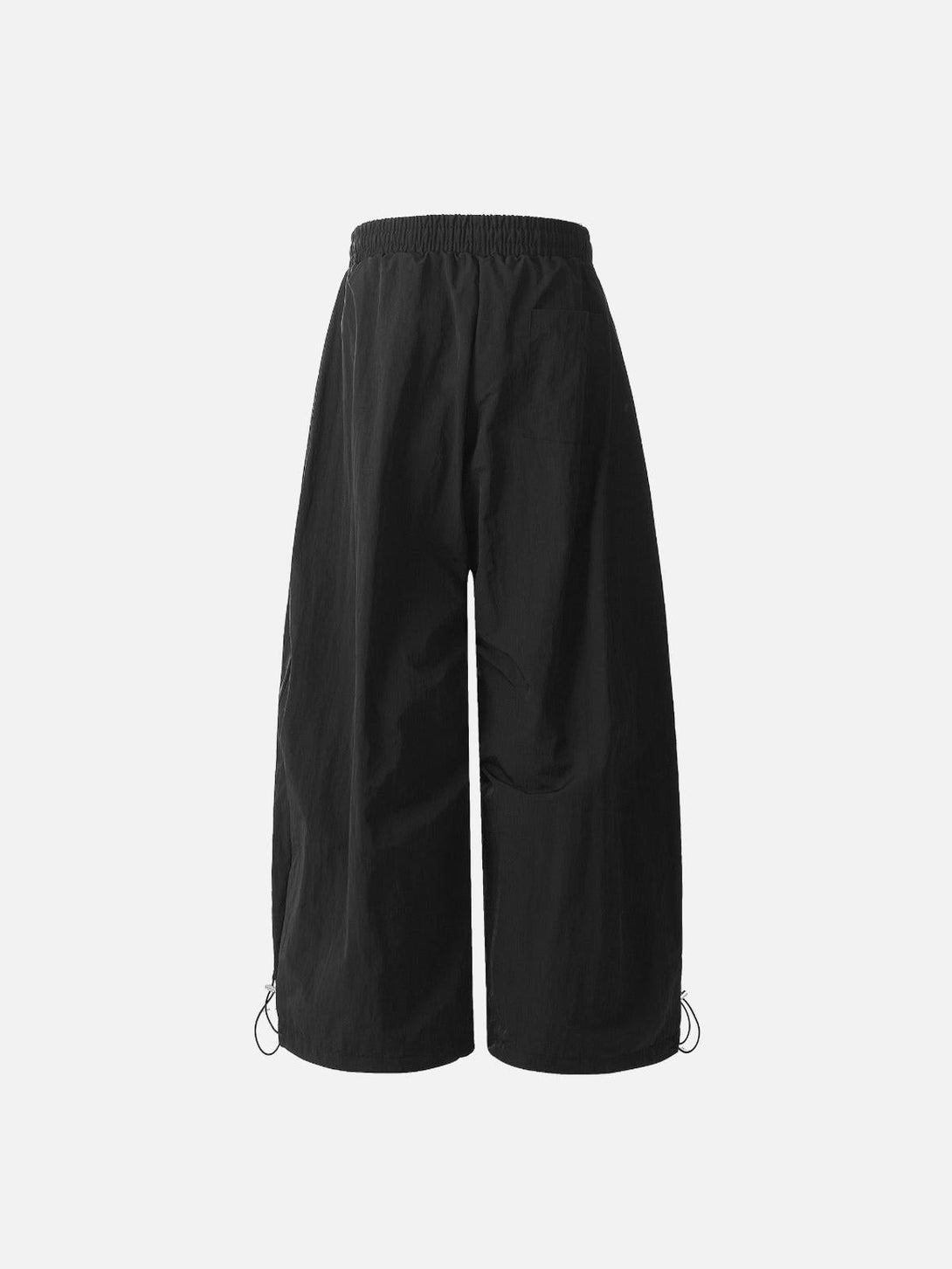 Back view of black baggy pleated cargo pants by TALISHKO, highlighting pocket detail.
