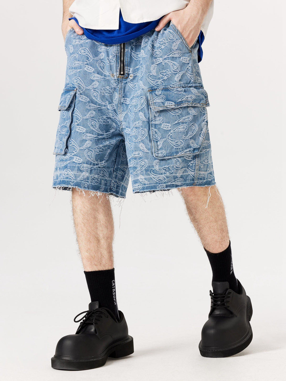Model styled in TALISHKO's bandana jacquard jorts, highlighting unique texture and casual vibe.
