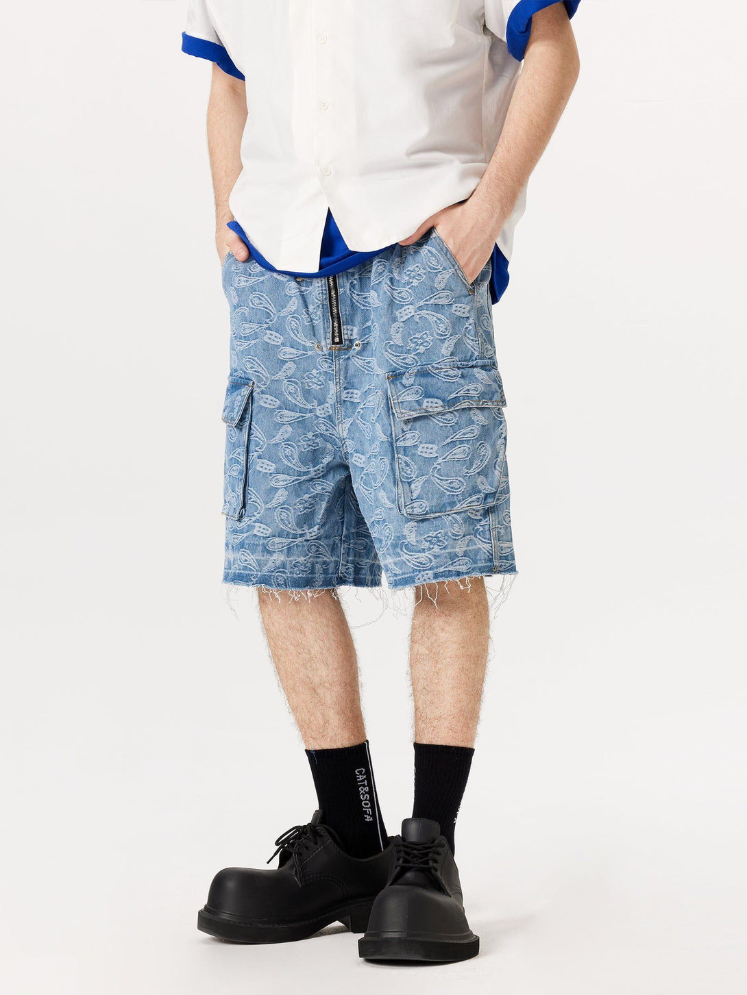 Model sporting TALISHKO's bandana jacquard washed jorts, paired with a relaxed white shirt.