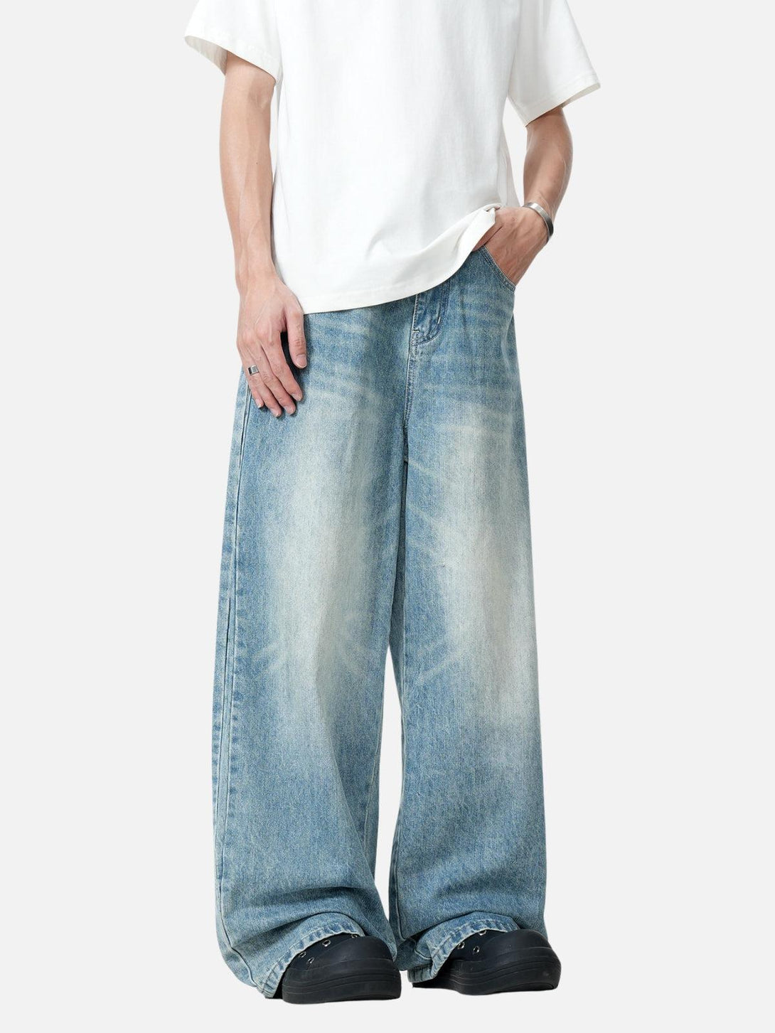 Model wearing TALISHKO barrel baggy jeans, showcasing a relaxed, casual style.